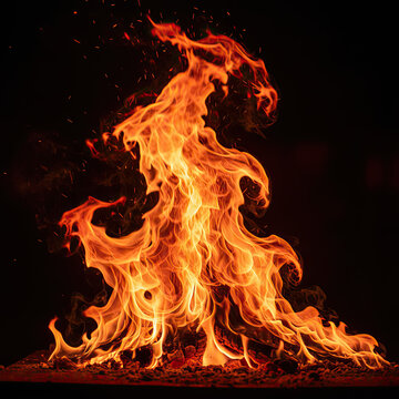 Vibrant flames rising high in darkness