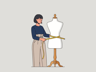 Fototapeta premium Woman measuring a dress forms waist with a yellow tape measure
