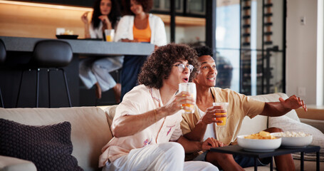 Men, friends and excited with watching tv on sofa with sports game, tournament or match in living...