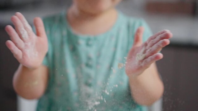 A Child's Playful Exploration with Flour: Captivating Moments of Joy and Creativity in the Kitchen Showcasing a Tiny Baker in Action