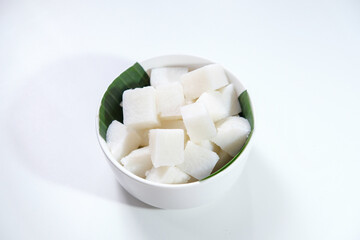 Sliced ketupat, Indonesian traditional rice cake, commonly served during Eid al-Fitr or lebaran. Isolated on white background