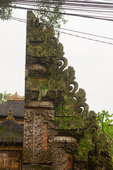Mossy Ornate Balinese Temple Gate Carvings in Lush Jungle Setting &ndash; Mystical Tropical Entrance