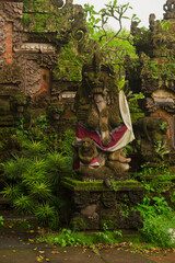 Ancient Mossy Guardian Statue in Mystical Balinese Jungle Temple &ndash; Serene Spiritual Charm