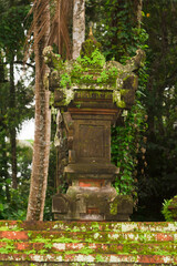Mystical Moss-Covered Balinese Shrine in Lush Jungle Temple Grounds &ndash; Serene Tropical Spirituality