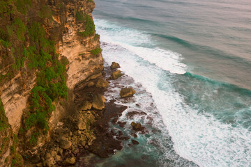 Powerful Ocean Waves Crashing Against Dramatic Limestone Cliffs &ndash; Tropical Bali Coastline Drama