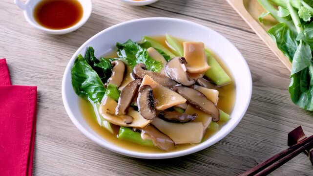 Abalone Brown Sauce on a wooden table.
