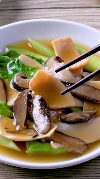 Abalone Brown Sauce on a wooden table.