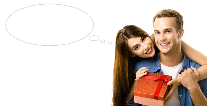 Big deals, discounts offers concept - expressive happy smiling cute young couple man woman open red gift box. Isolated white background with empty mockup speech bubble. Mock up ad image