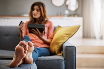 Obraz premium Woman, tablet and sofa with credit card for online banking, payment or shopping in home. Female person, shopper or debit with technology for ecommerce, wireless transaction or purchase app in house
