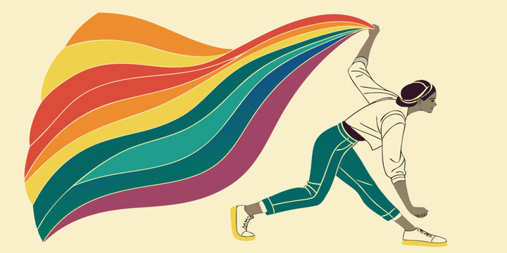 A person holding a large, colorful flag in a dynamic pose