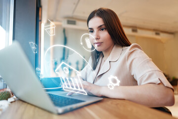 Banking invoice payment being processed by a woman using a laptop in an office setting