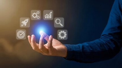 Fototapeta premium Businessman holding hand with glowing icons floating above palm in air