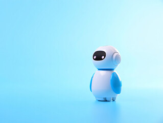 Obraz premium Cute robotic toy with large black eyes on blue background standing alone