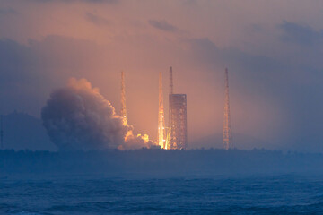 Naklejka premium Rocket launch at morning with smoky by ocean, Launcher in Wenchang Hainan, China