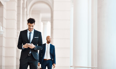 Fototapeta premium Businessman, reading and happy with smartphone, outdoor or communication for meeting schedule on web. Employee, walking and person with mobile for networking, space and texting with smile and online