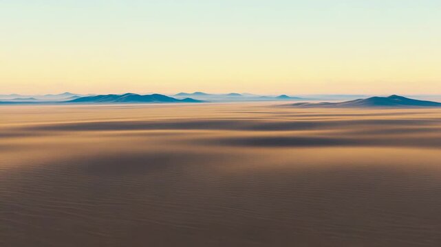 Futuristic interior space with minimalist design and golden accents, offering a panoramic view of a vast desert landscape bathed in the warm light of sunrise
