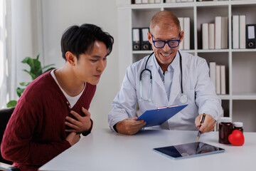 Fototapeta premium Male patient listening to a doctor in hospital.Medical care, Empathy, Consoling patient 