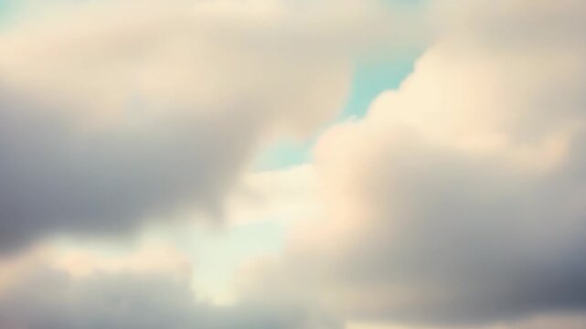 Gentle pastel sky at dawn or dusk with soft, fluffy clouds and a calm gradient of warm and cool tones, creating a serene, dreamy atmosphere for backgrounds and relaxation