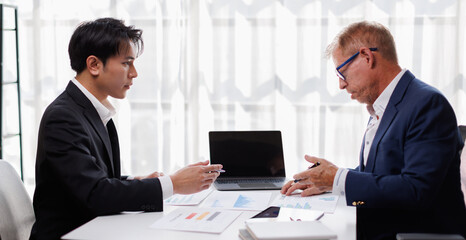 Fototapeta premium Businessman team working at office with document on his desk, doing planning analyzing the financial report, business plan investment, finance analysis concept. Economic business discussions.