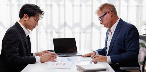 Fototapeta premium Businessman team working at office with document on his desk, doing planning analyzing the financial report, business plan investment, finance analysis concept. Economic business discussions.