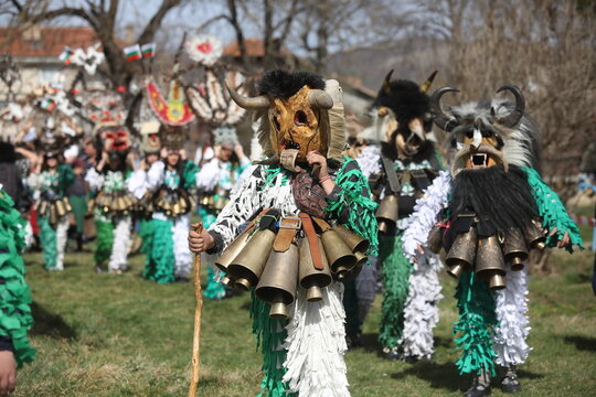 Zemen, Bulgaria - March 15, 2025: Masquerade festival Surva in Zemen, Bulgaria. People with mask called Kukeri dance and perform to scare the evil spirits.