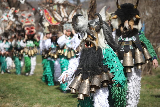Zemen, Bulgaria - March 15, 2025: Masquerade festival Surva in Zemen, Bulgaria. People with mask called Kukeri dance and perform to scare the evil spirits.