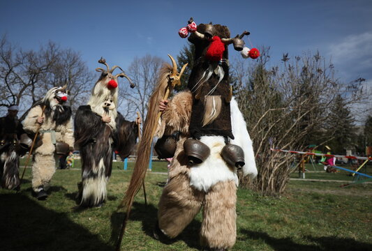 Zemen, Bulgaria - March 15, 2025: Masquerade festival Surva in Zemen, Bulgaria. People with mask called Kukeri dance and perform to scare the evil spirits.