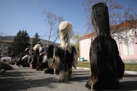 Zemen, Bulgaria - March 15, 2025: Masquerade festival Surva in Zemen, Bulgaria. People with mask called Kukeri dance and perform to scare the evil spirits.