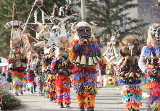 Zemen, Bulgaria - March 15, 2025: Masquerade festival Surva in Zemen, Bulgaria. People with mask called Kukeri dance and perform to scare the evil spirits.