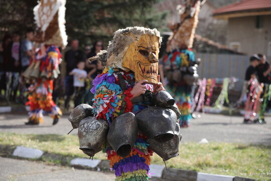 Zemen, Bulgaria - March 15, 2025: Masquerade festival Surva in Zemen, Bulgaria. People with mask called Kukeri dance and perform to scare the evil spirits.