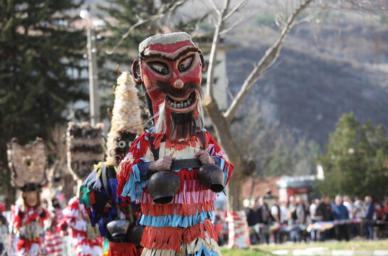 Zemen, Bulgaria - March 15, 2025: Masquerade festival Surva in Zemen, Bulgaria. People with mask called Kukeri dance and perform to scare the evil spirits.