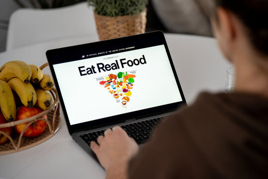 Woman reading Eat Real Food official U.S. government website. Platform promotes the Dietary Guidelines for Americans, shows new inverted pyramid on February 17, 2026 in Krakow, Poland.
