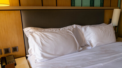 The Comfort Zone with  White Bed in a Hotel Room	