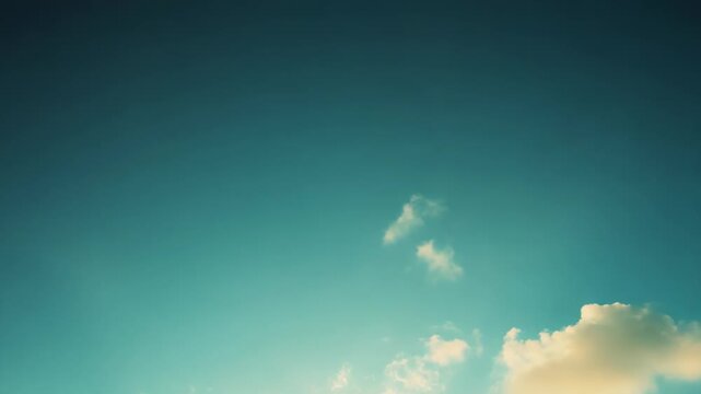 Bright sunbeams breaking through soft cumulus clouds in a clear blue sky, casting warm, tranquil light and evoking peaceful, airy summer serenity and optimism