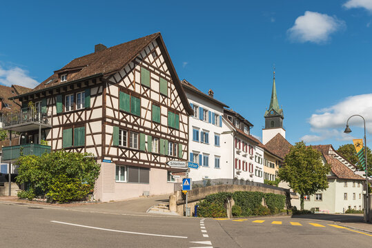Traditional half-timbered house (Fachwerk) and church St. Moritz in the village center of Hallau in the Klettgau wine region of Switzerland