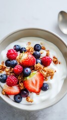Yogurt bowl with fresh berries and granola, healthy breakfast and clean eating concept