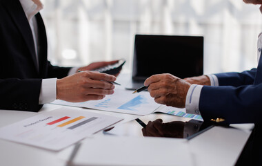 Fototapeta premium Auditor and accountant team working in office, analyze financial data and accounting record with calculator finance and taxation planning for profitable cash flow. 