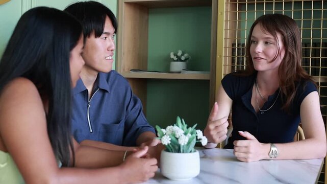 International University Students Chatting at a Cafe