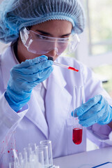 Vertical Horizon Woman scientist lab looks at science microscope medical test research biology chemistry. Vertical Females Technician Laboratory pharmacy research. Scientist Chemistry Medical test lab