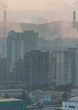 City buildings in the smoke, Pyongan Province, Pyongyang, North Korea