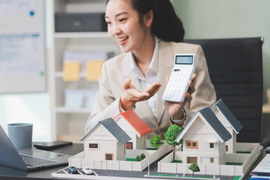 real estate agent home miniature model on documents sale and purchase of apartment notarial deed