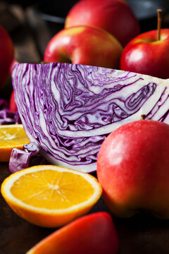 Sliced red cabbage, red apples and sliced orange