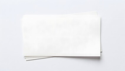 Stack of blank white paper sheets lying on a white background
