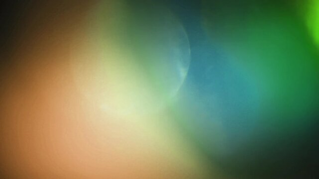 light leak and bokeh overlay with swirling green and orange hues. This footage is perfect for adding a creative visual element to videos.