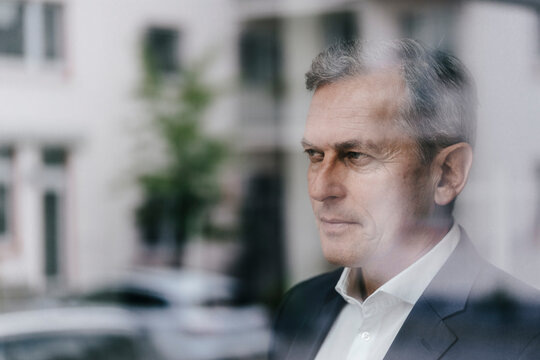 Businessman looking out of window