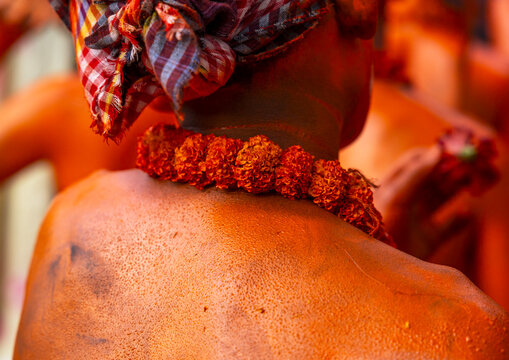 Neclace flowers of a Hindu devotee covered with red color in Lal Kach festival, Dhaka Division, Munshiganj Sadar, Bangladesh