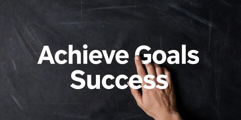 Obraz premium Achieve goals and success is written on a dark scratched surface with a finger pointing