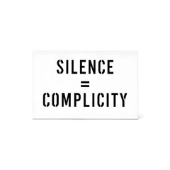 Powerful social activism sign with Silence Equals Complicity slogan