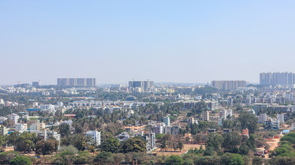 Obraz premium Jakkur Lake with High-Rise Residential Development – Expanding Bangalore Skyline, Urban Growth, and Emerging Real Estate Corridor