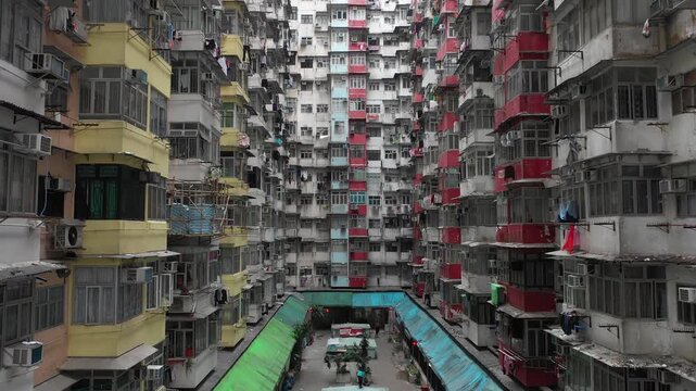Slow drone flight through iconic 'Monster Building', a government subsidized housing block (dating from the 1960s) in Quarry Bay, Hong Kong